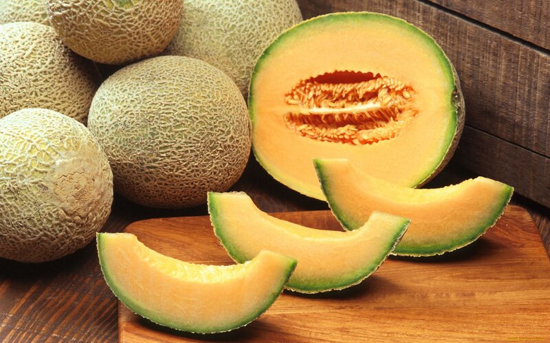 Sliced Cantaloupes on Wood