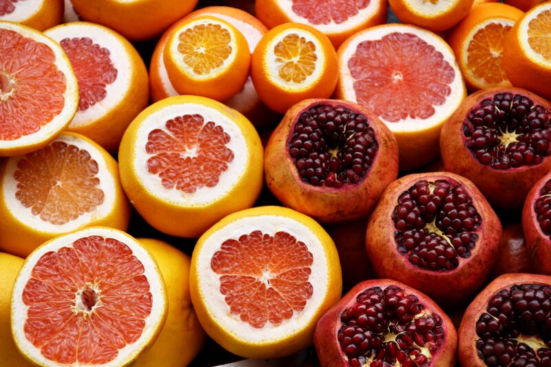 sliced citrus and pomegranate fruits