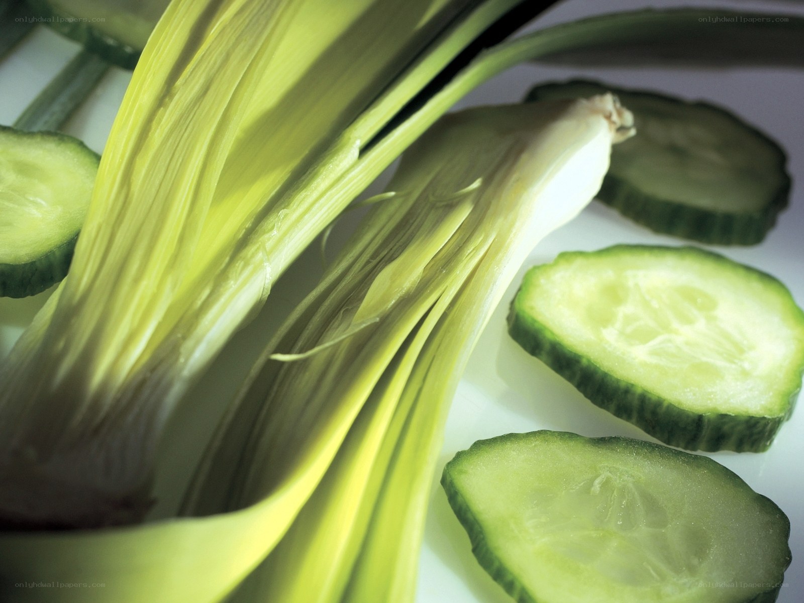 Sliced cucumbers and green onions