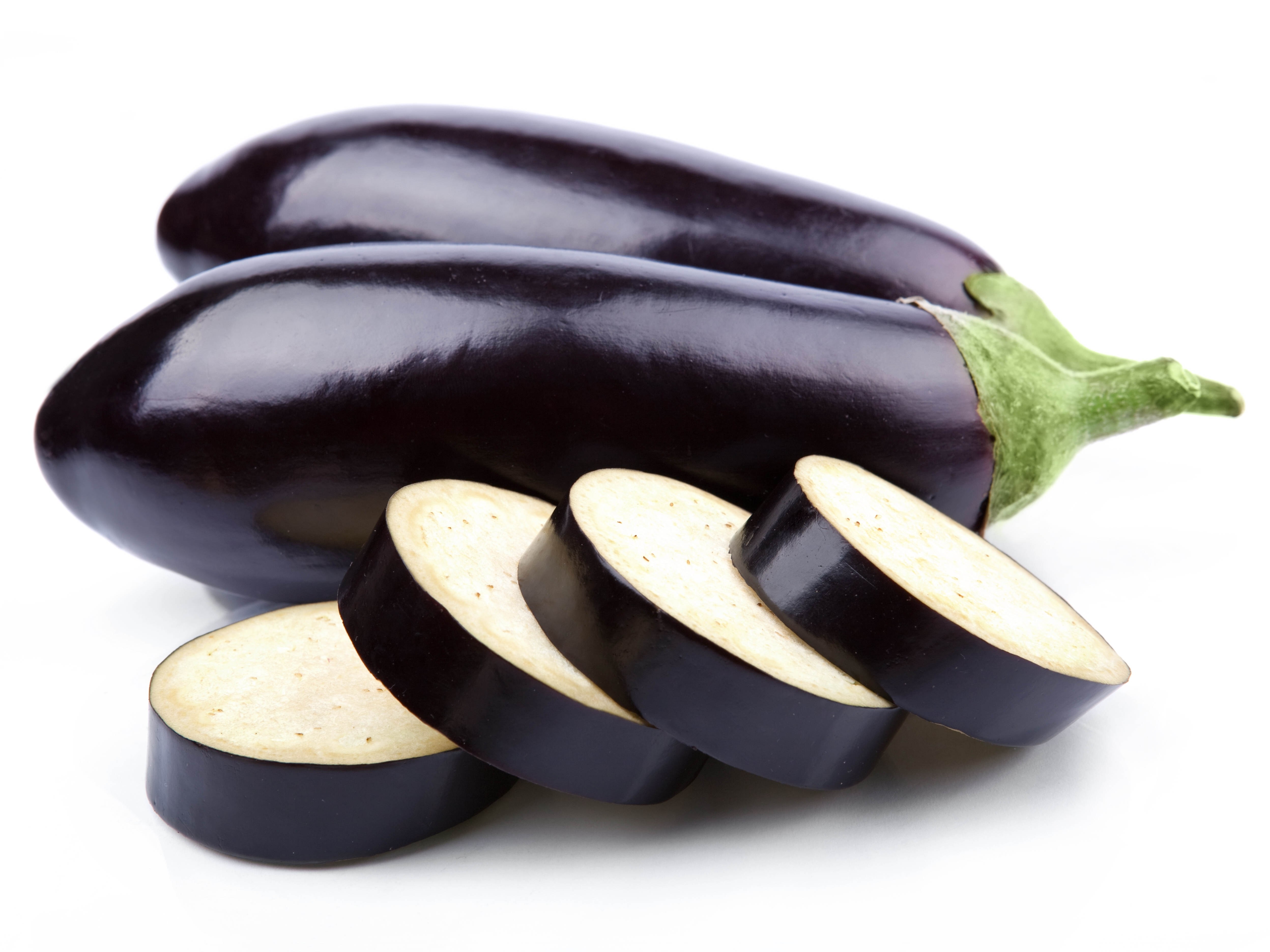Sliced eggplants on white