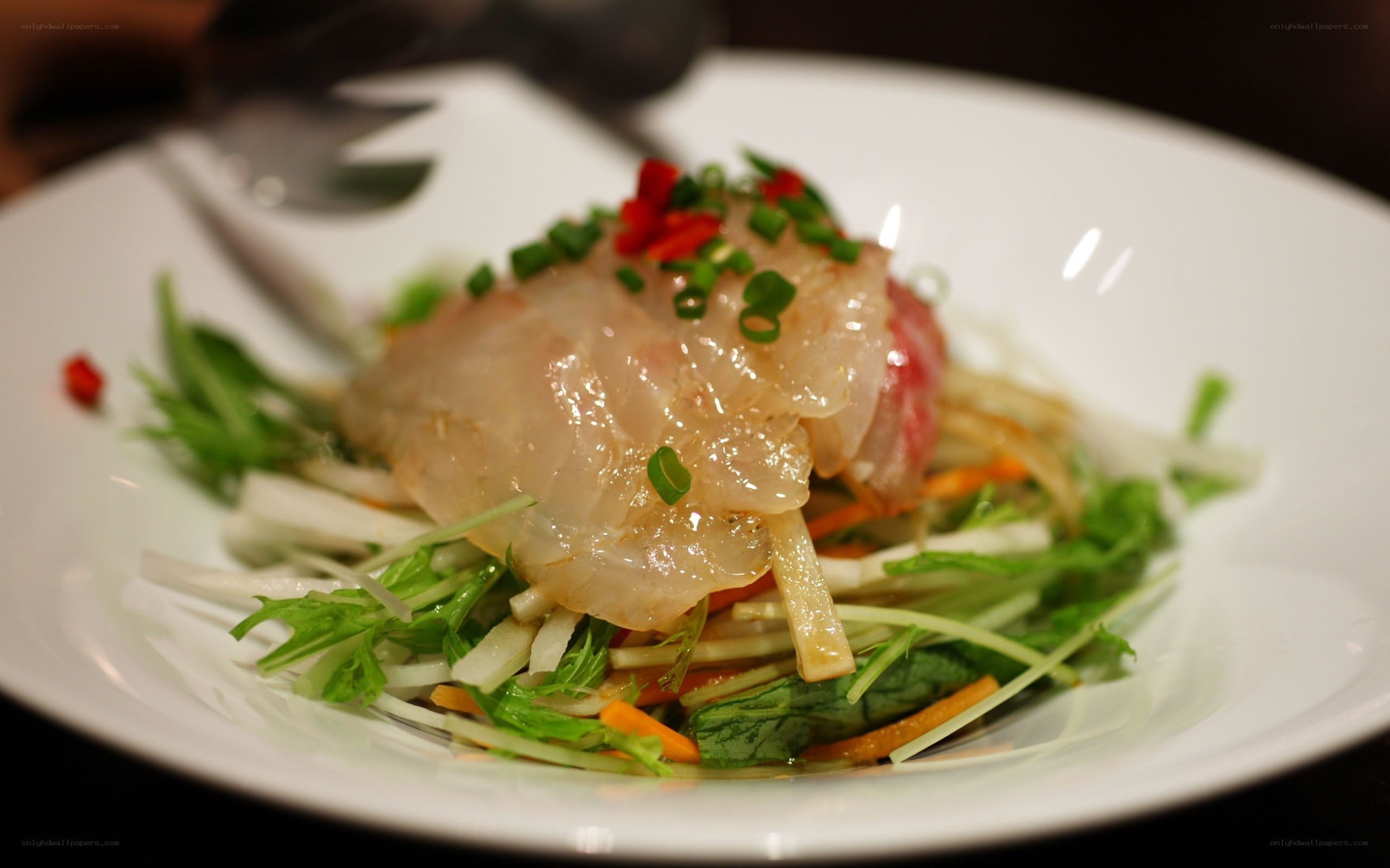 Sliced fish salad with vegetables