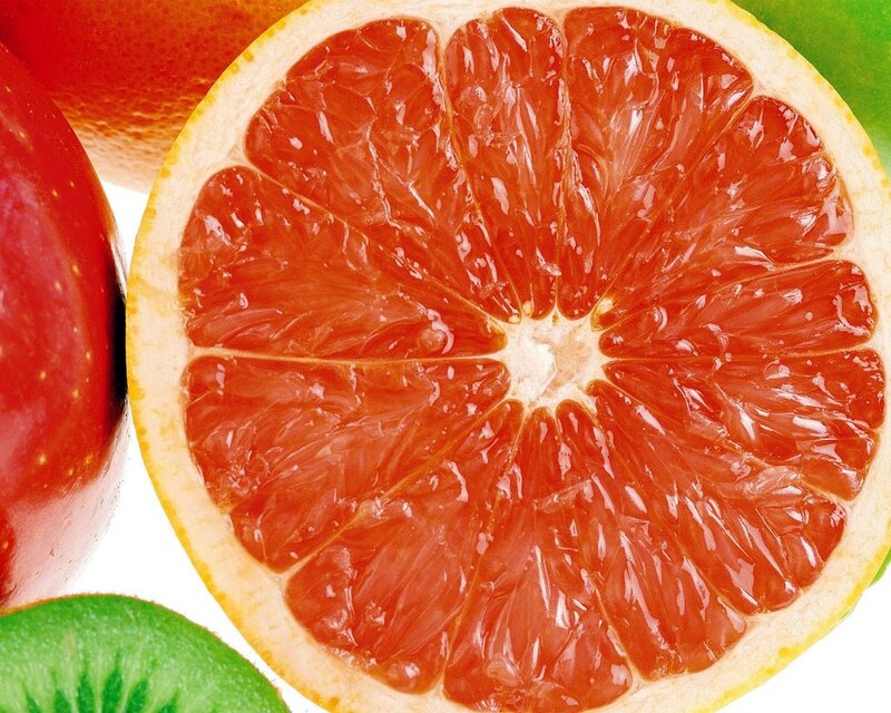 Sliced grapefruit with fruits