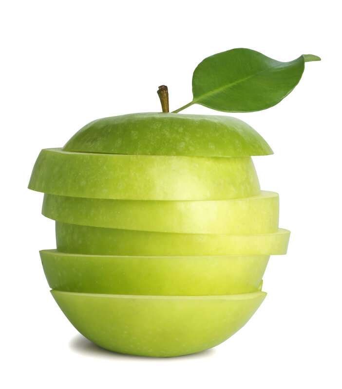 sliced green apple with leaf