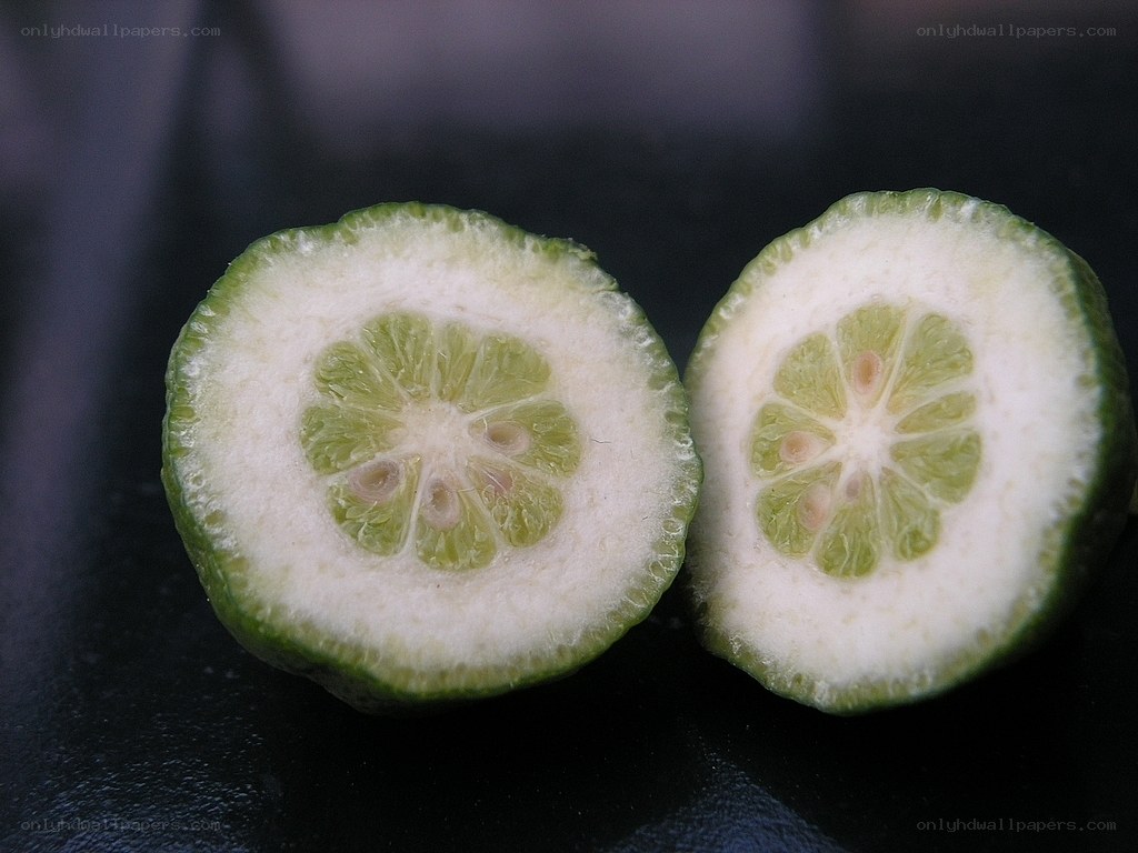 sliced green citrus fruit