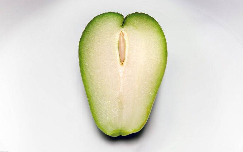 sliced green fruit with seed