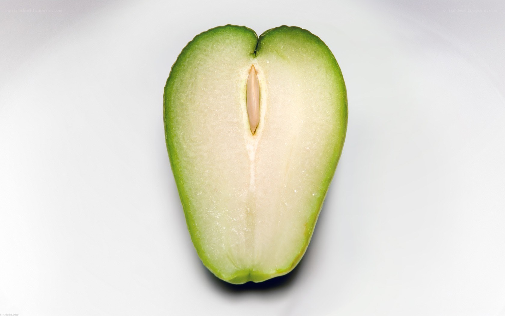 sliced green fruit with seed
