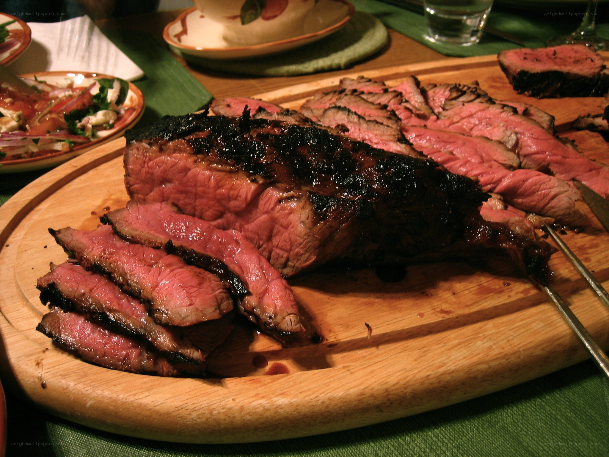 Sliced grilled steak on a board