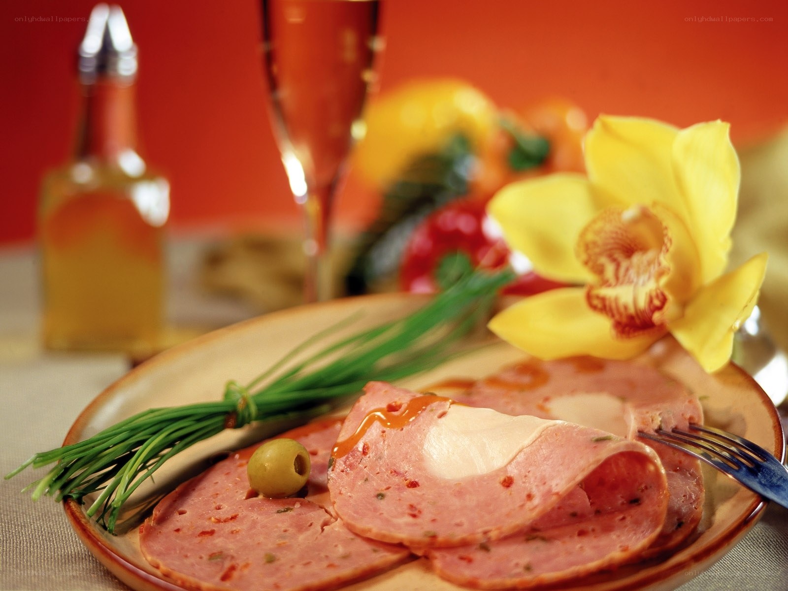 Sliced ham with chives and flower