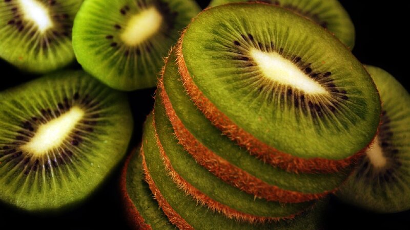 Sliced Kiwi Fruit — Green, Dramatic, Photograph, Slices, Black Seeds