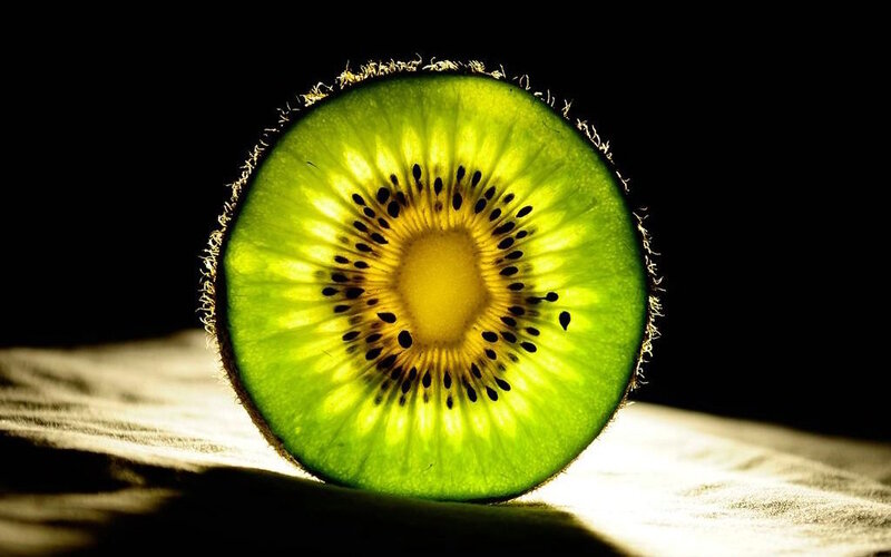 Sliced Kiwi Fruit — Green, Dramatic, Photograph, Wooden Surface