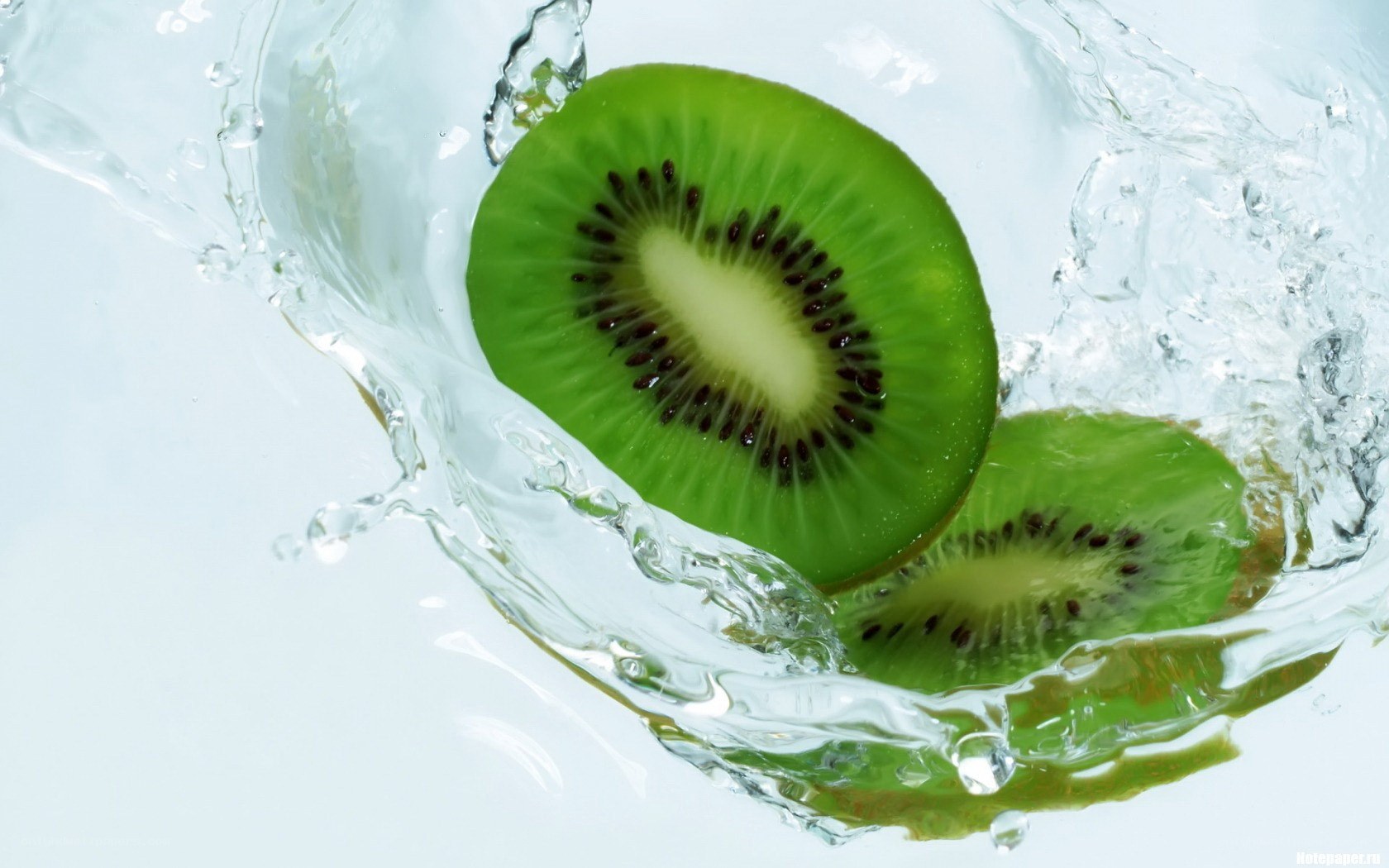 sliced kiwi in water splash
