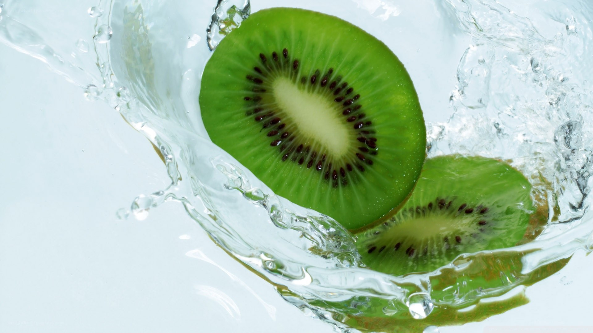 sliced kiwi in water splash