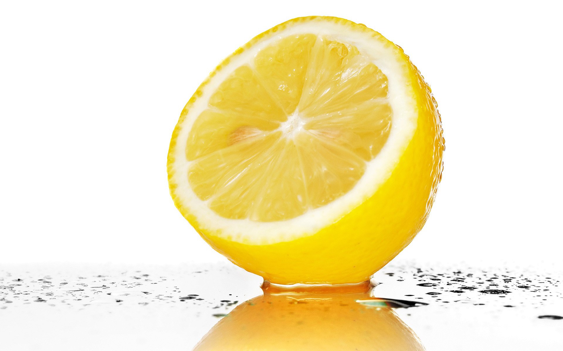 sliced lemon on wet surface