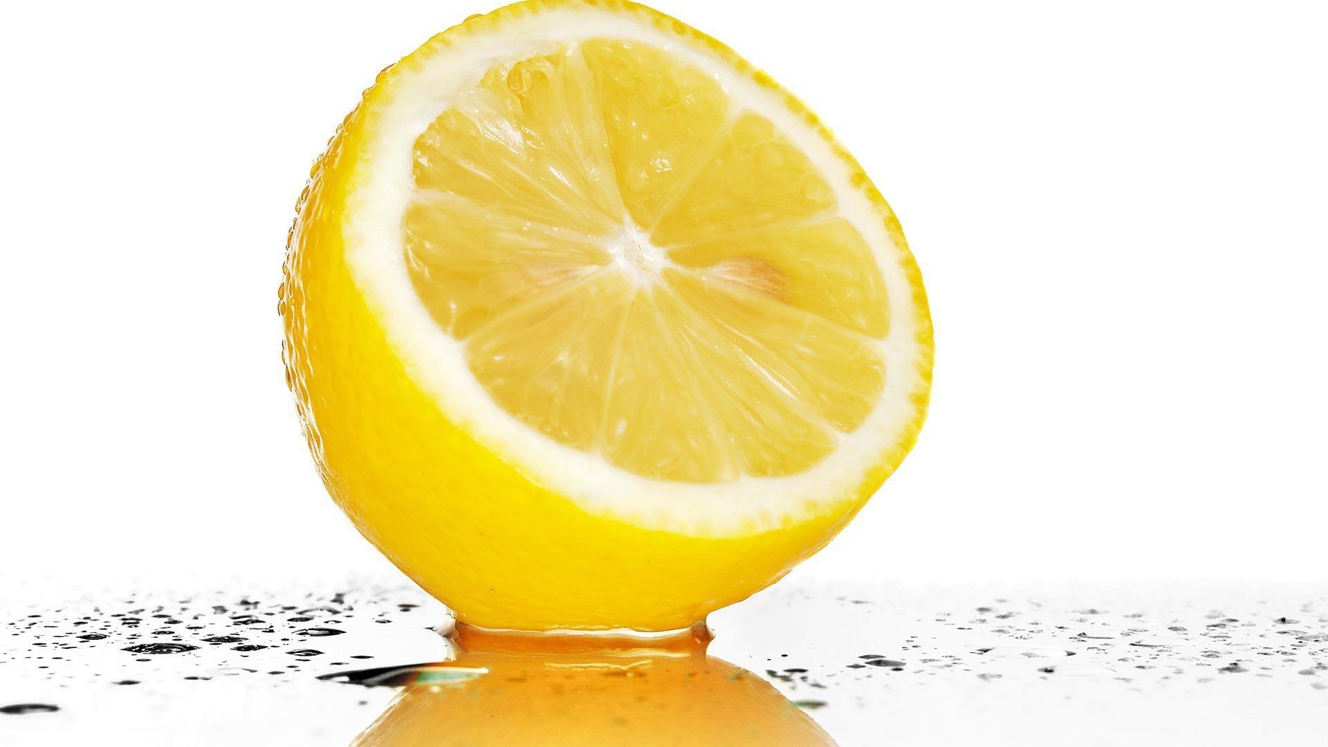 sliced lemon on wet surface