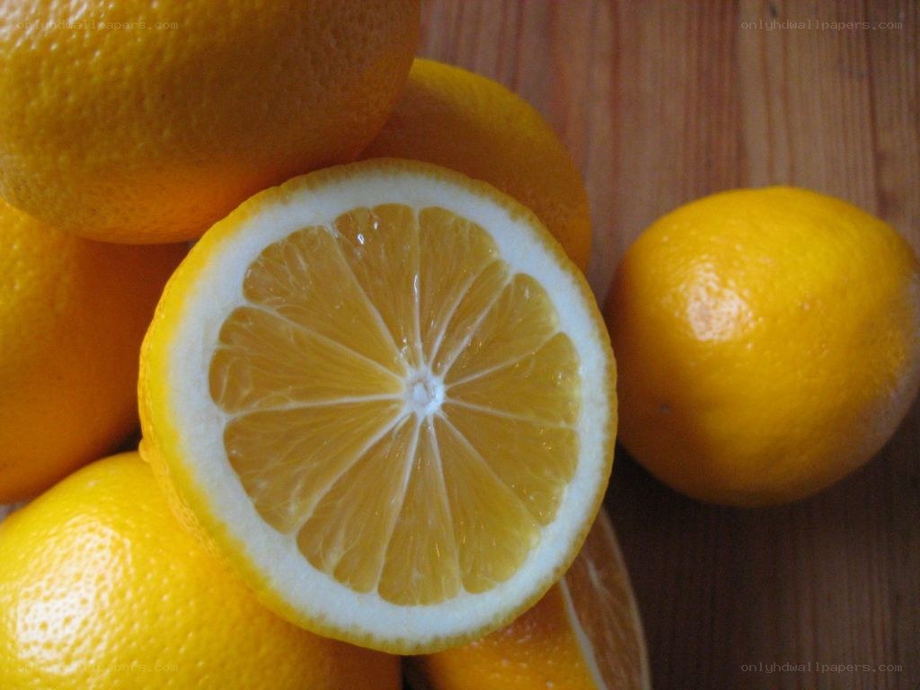 Sliced lemon on wooden surface