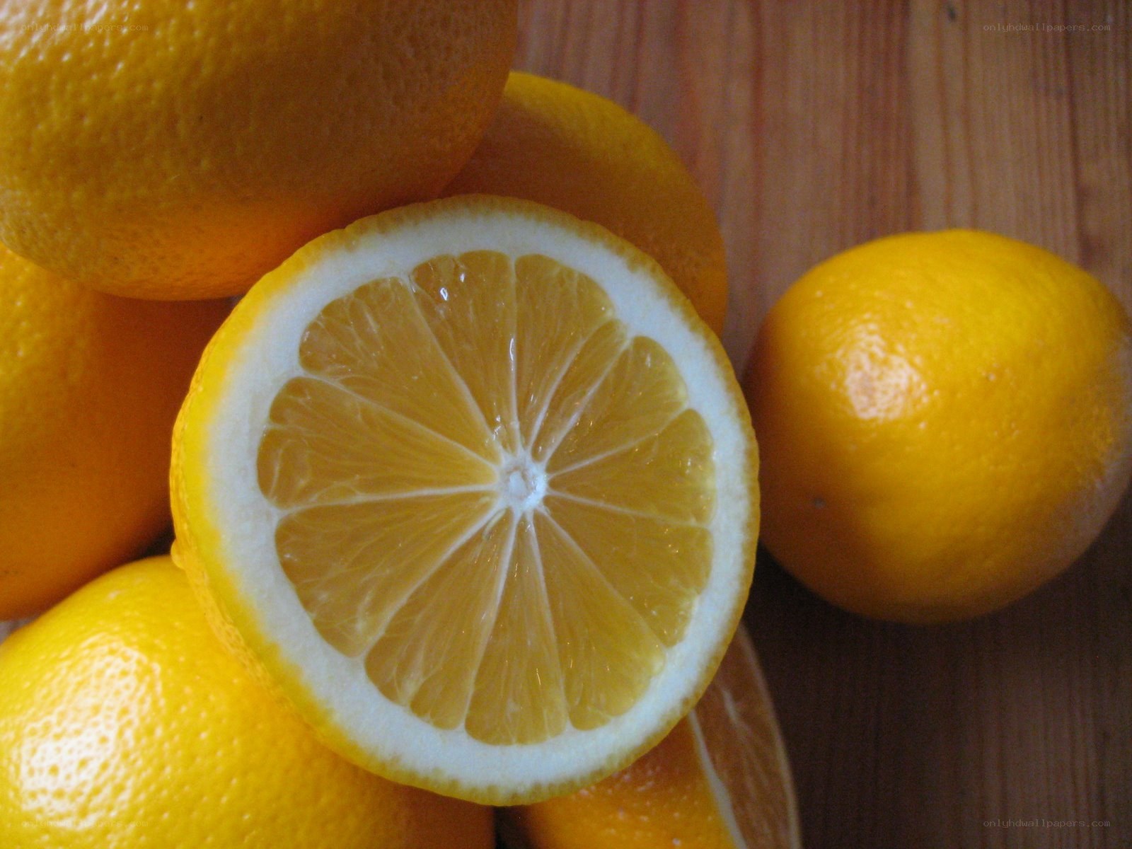 Sliced lemon on wooden surface