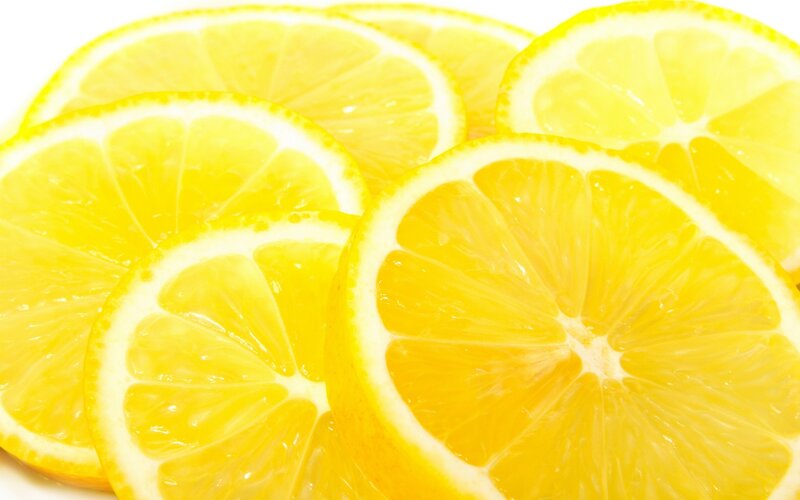 sliced lemons on white