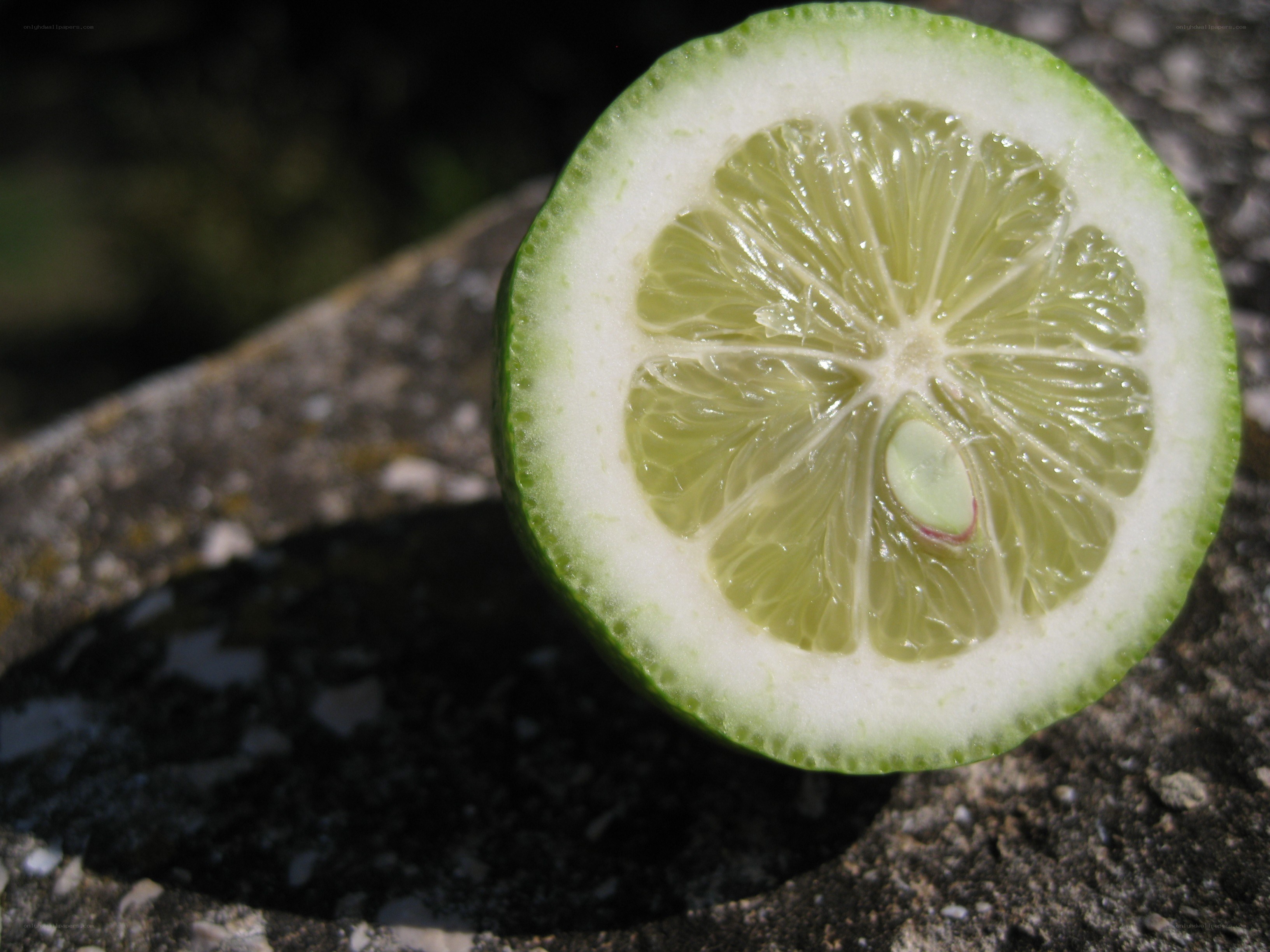 sliced lime on stone
