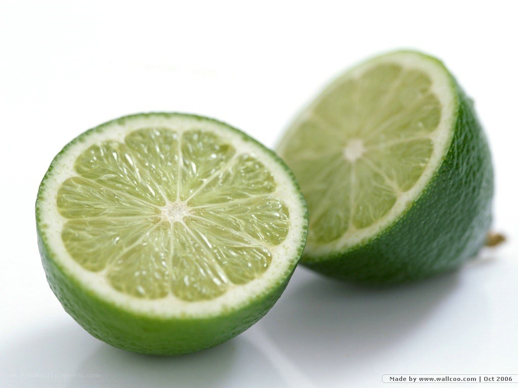 sliced lime on white background
