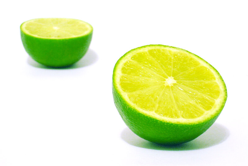 sliced lime on white background