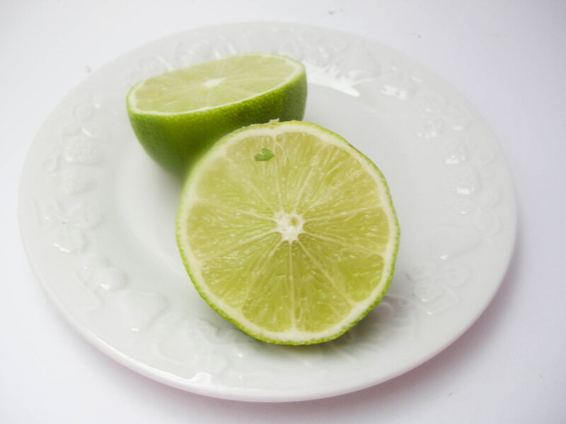 sliced lime on white plate