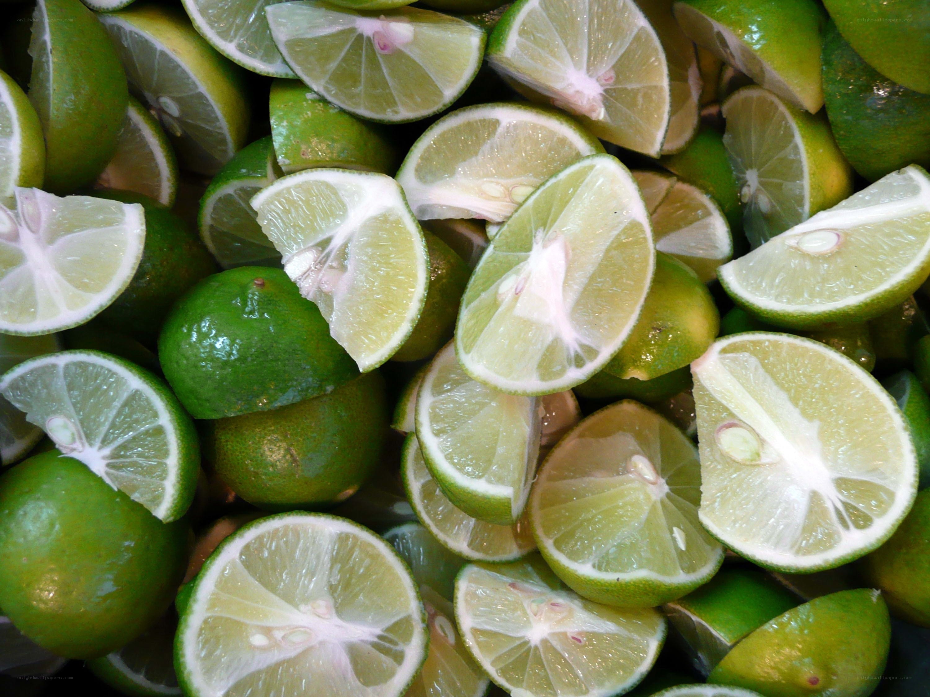 sliced limes in a pile