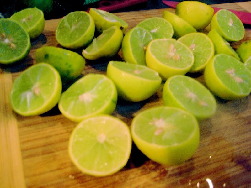 sliced limes on a cutting board