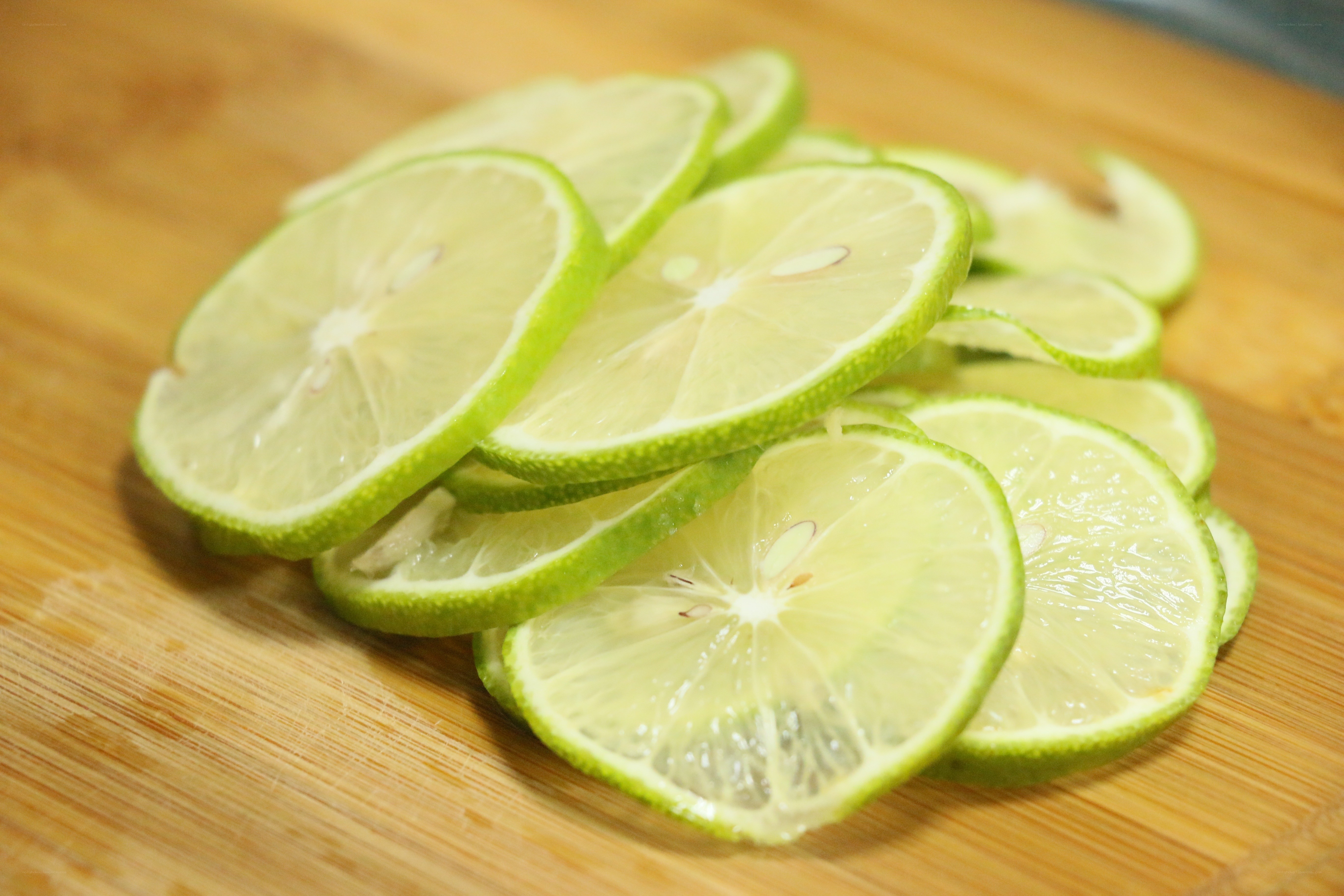 sliced limes on cutting board