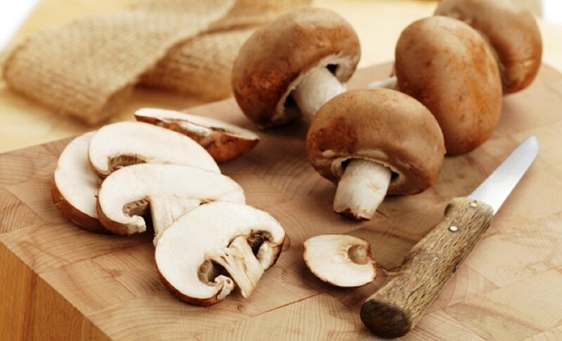 Sliced Mushrooms on Cutting Board
