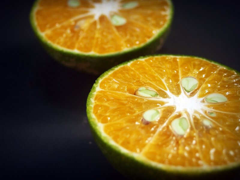 Sliced Orange Fruit — Dramatic, Photograph, Seeds