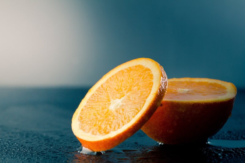 Sliced Orange Fruit — Dramatic, Photograph, Surface, Drops, Blue, White
