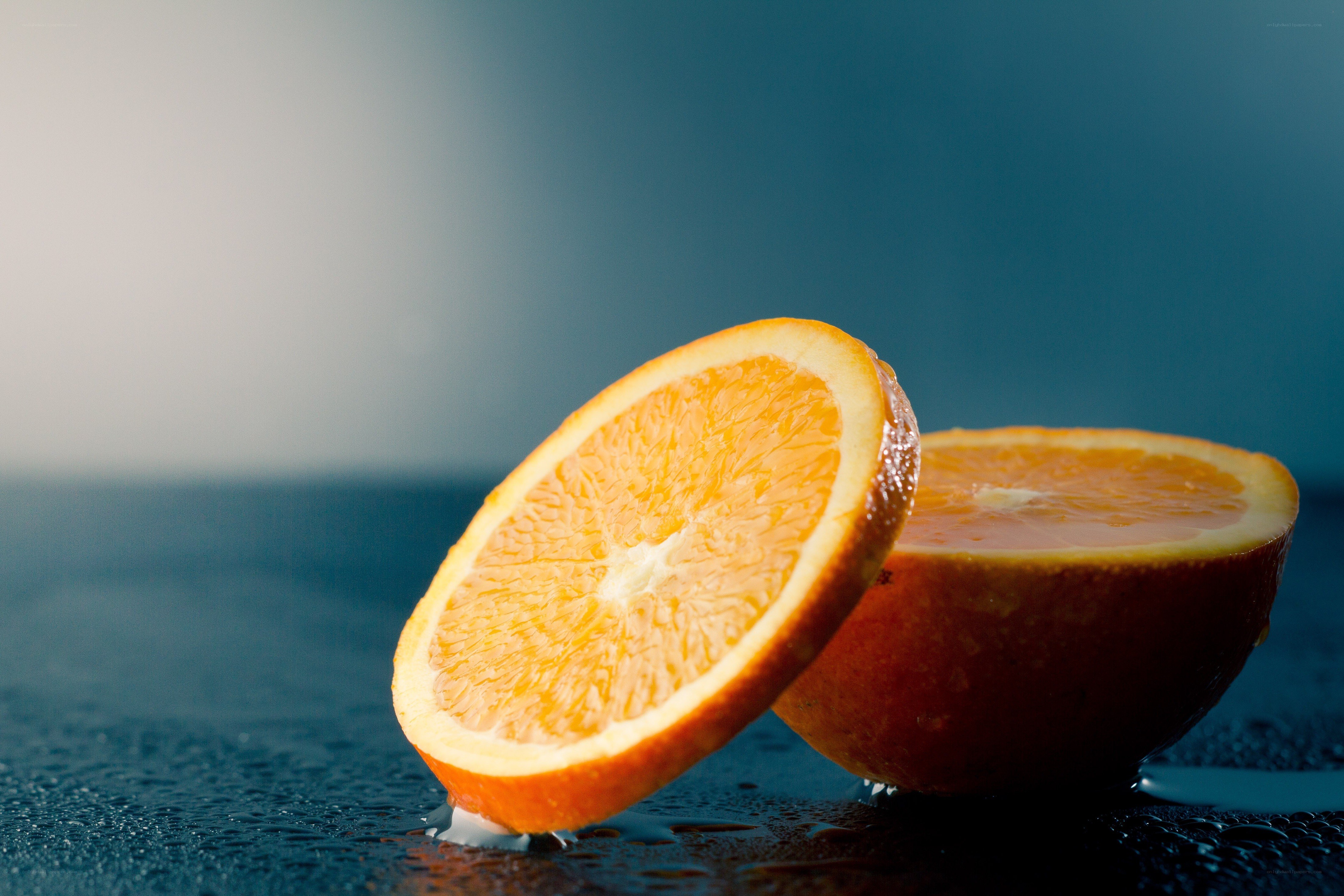 sliced orange on wet surface