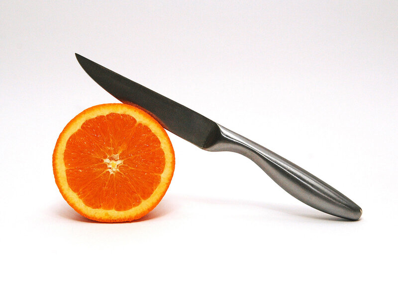Sliced Orange with Knife