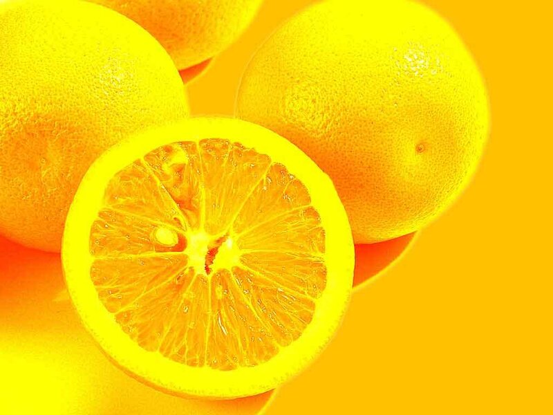 sliced oranges on yellow