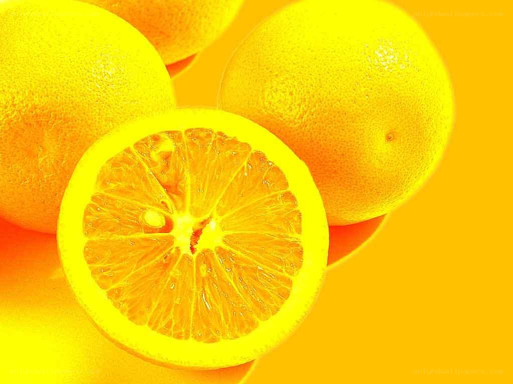 sliced oranges on yellow