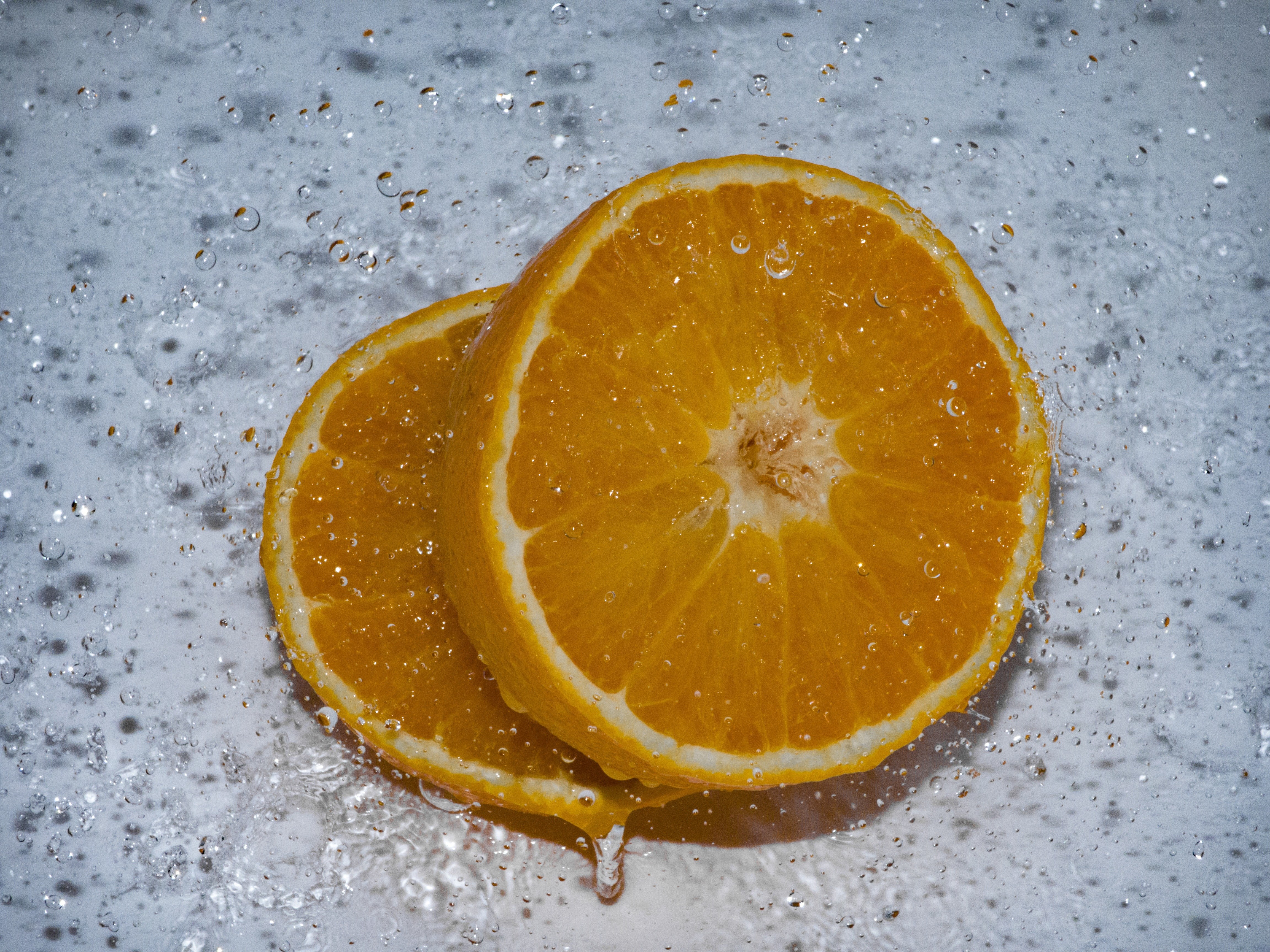 sliced oranges with water droplets
