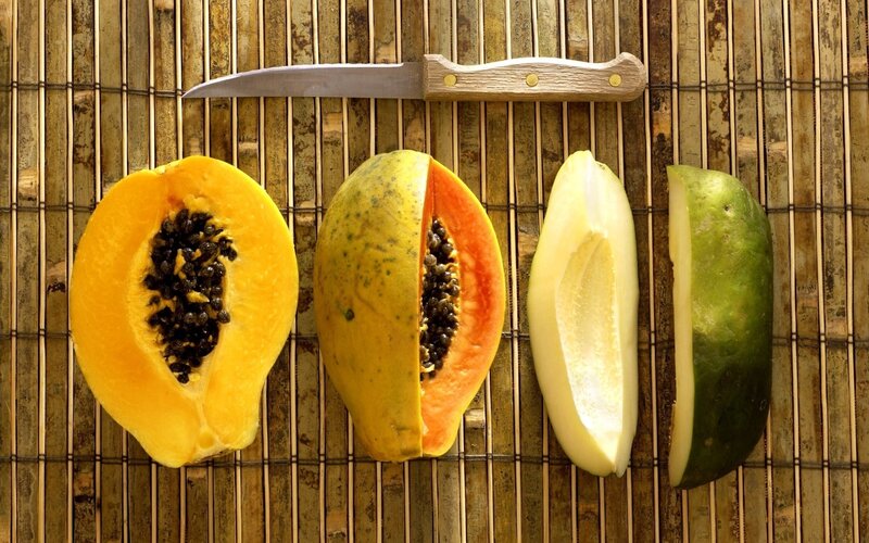 Sliced Papayas on Mat — Yellow