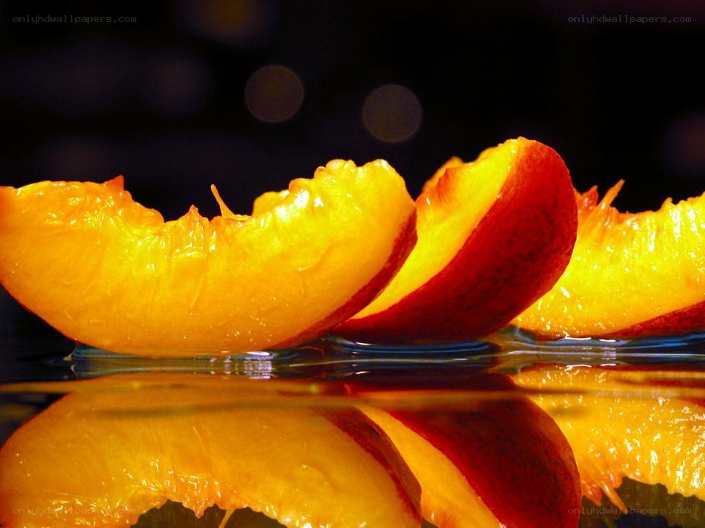 sliced peaches on water
