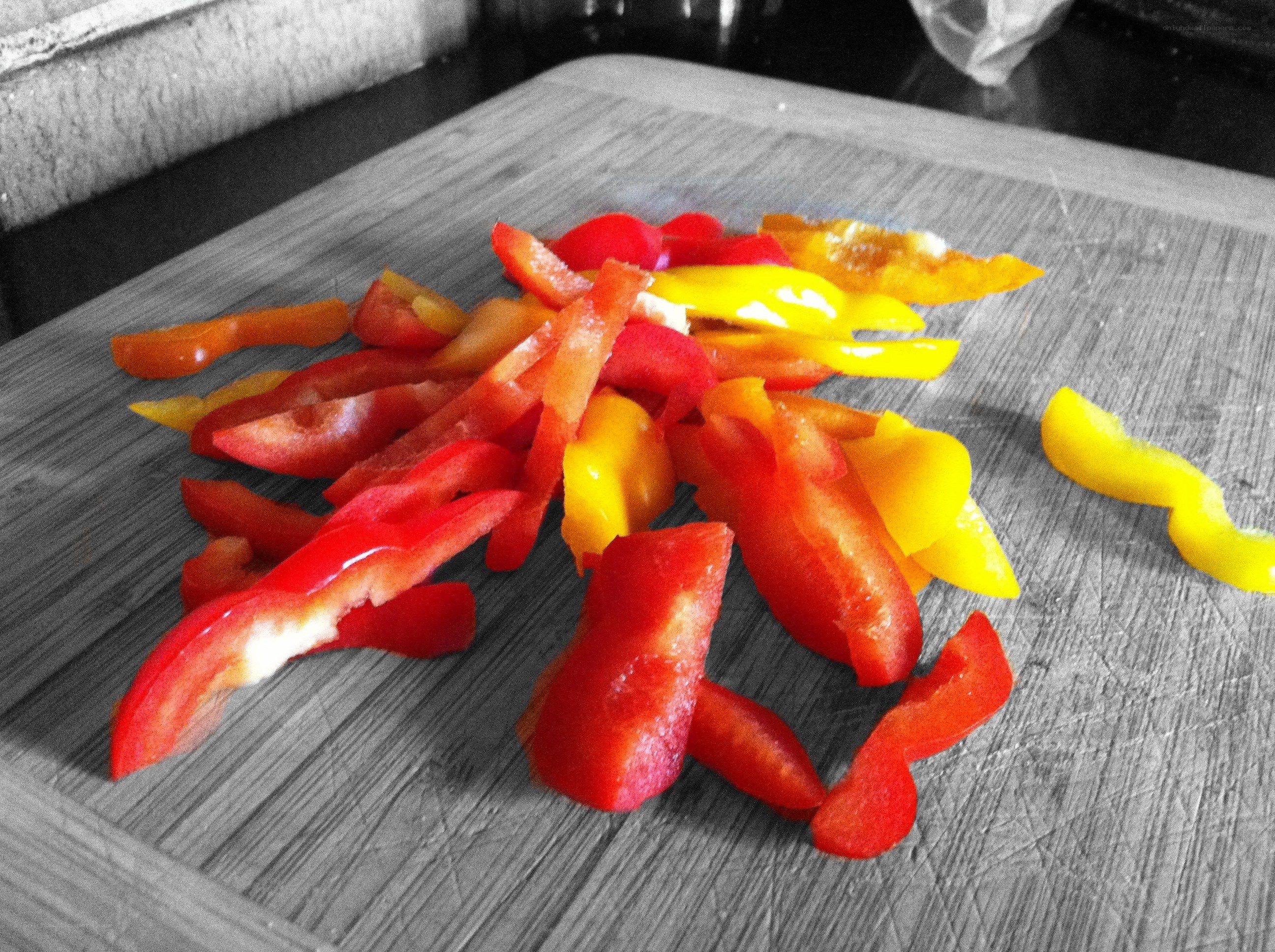 sliced peppers on cutting board