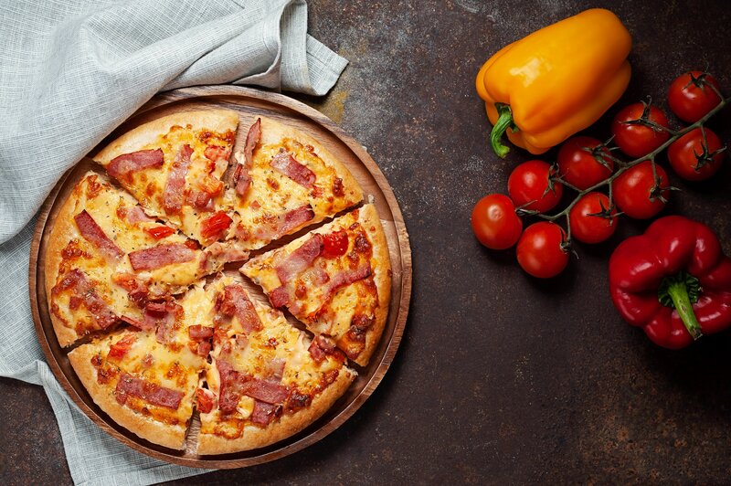 Sliced Pizza on Wooden Board