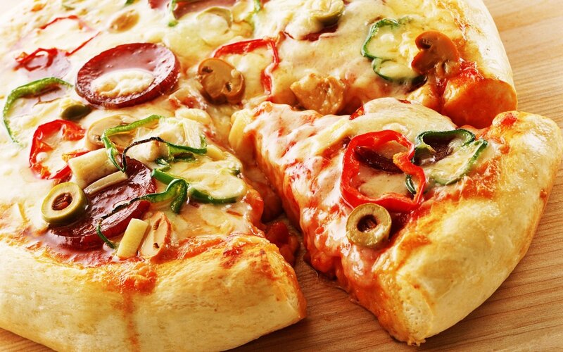 Sliced pizza with vegetables