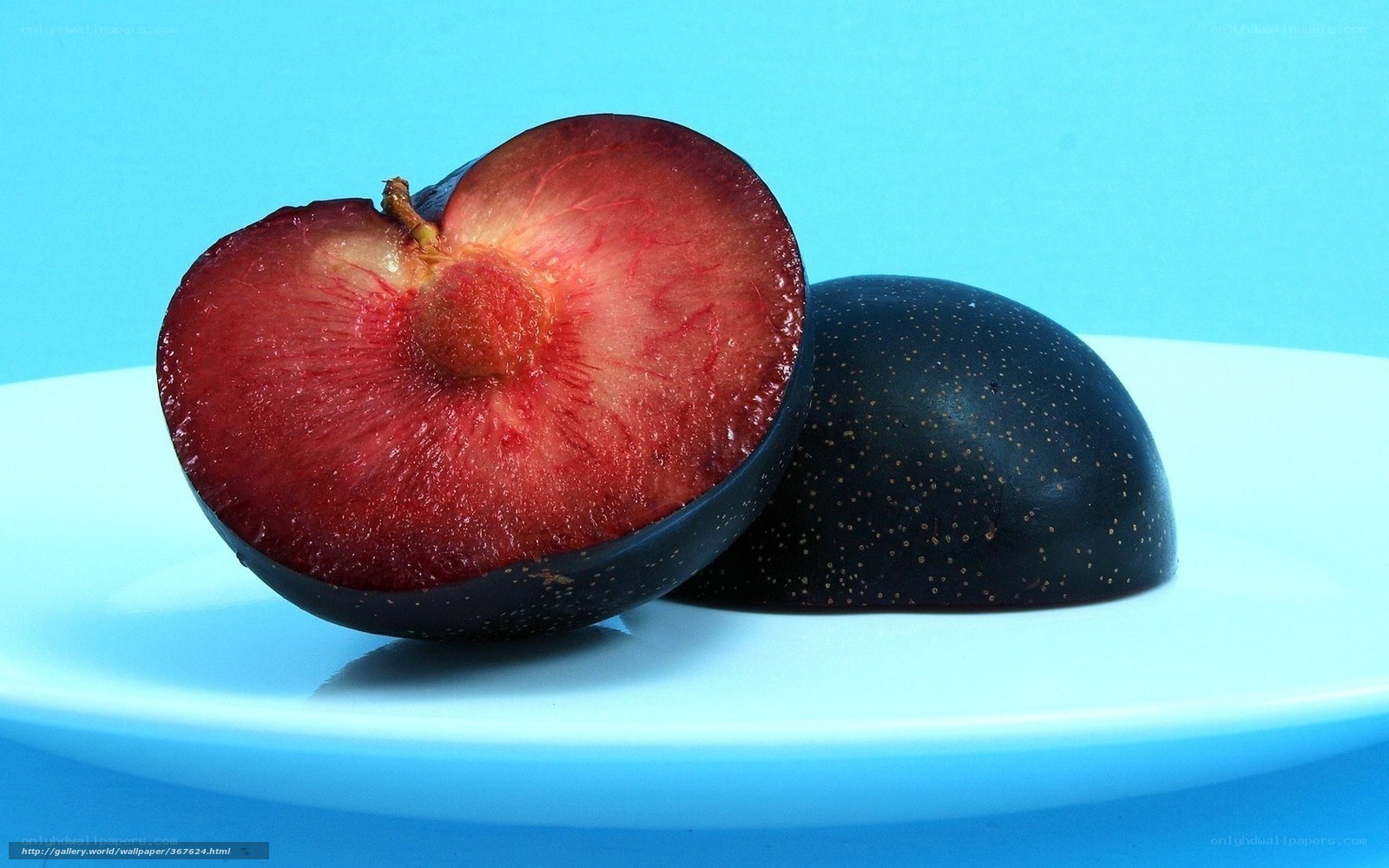 sliced plum on a plate