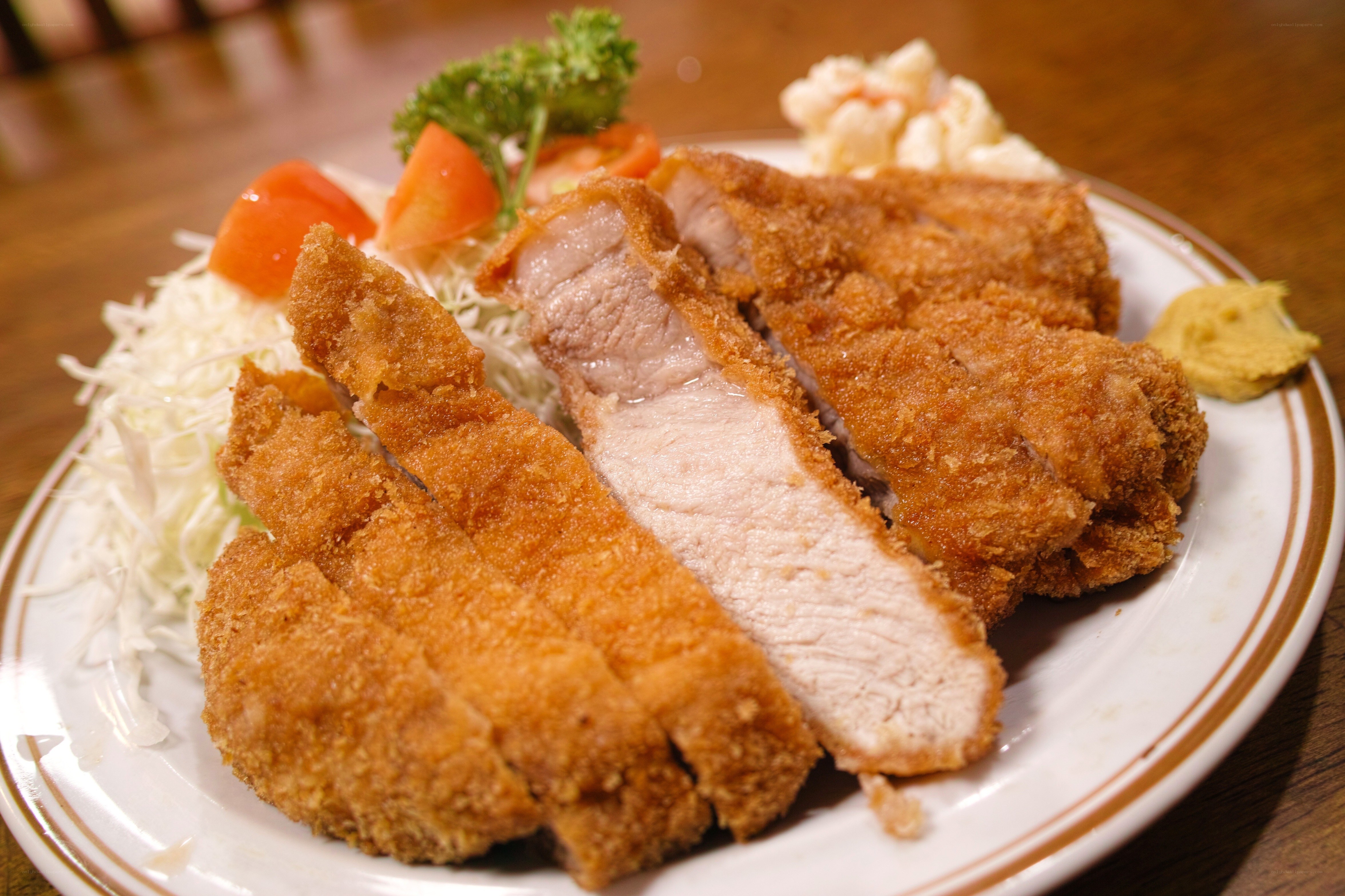 Sliced pork cutlet with garnish