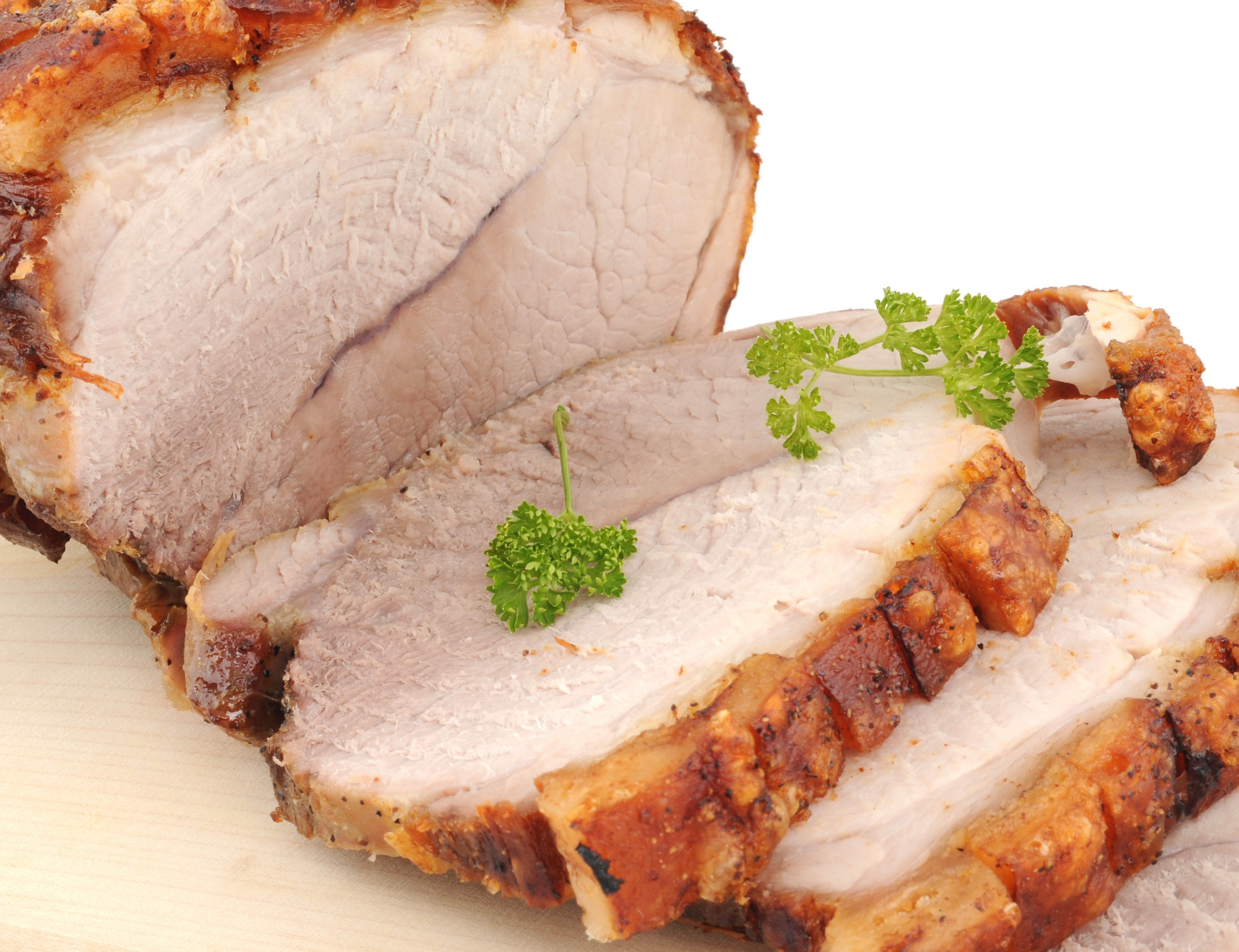 sliced roasted pork with herbs