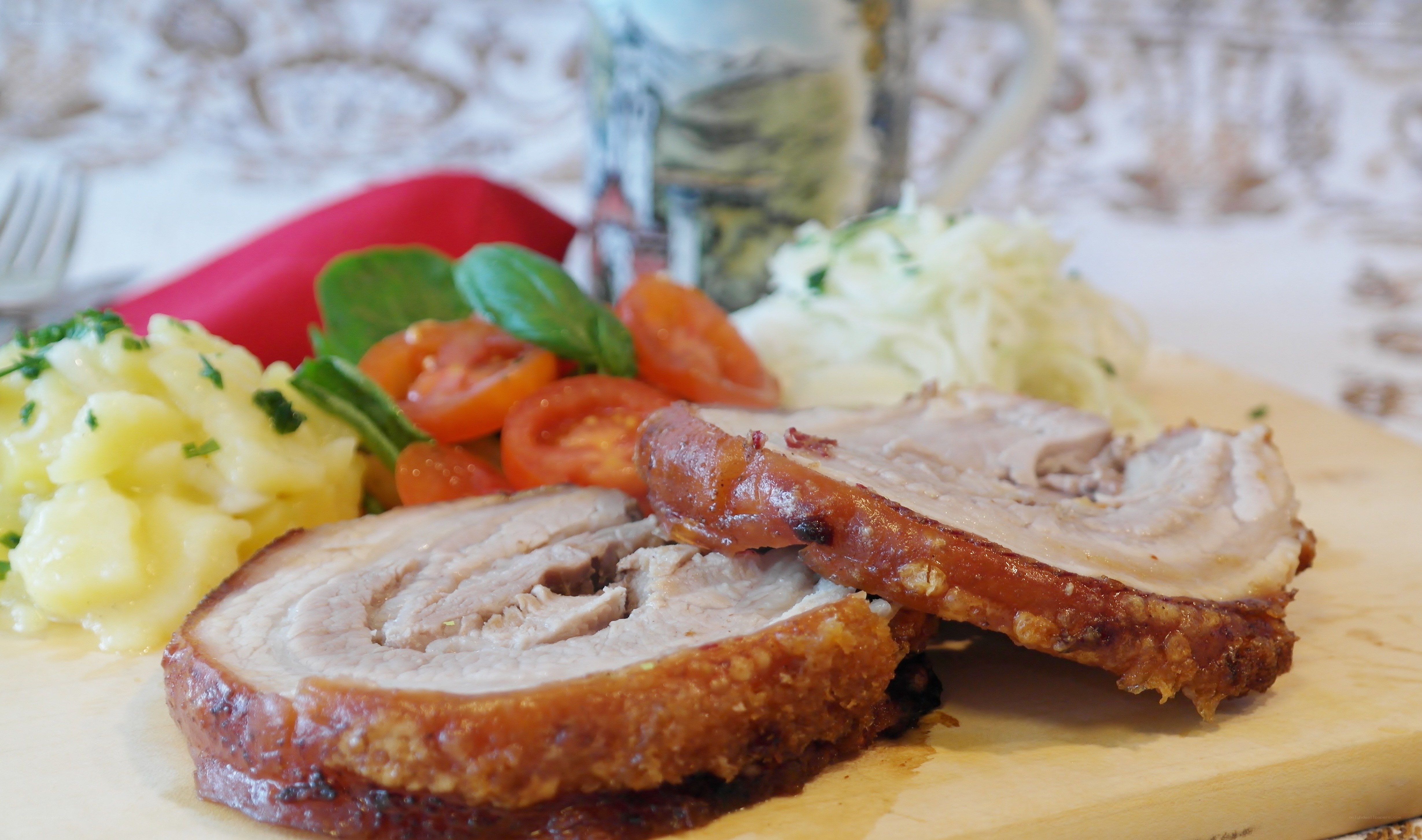 sliced roasted pork with sides