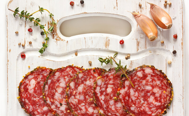 Sliced Salami on Cutting Board — Red