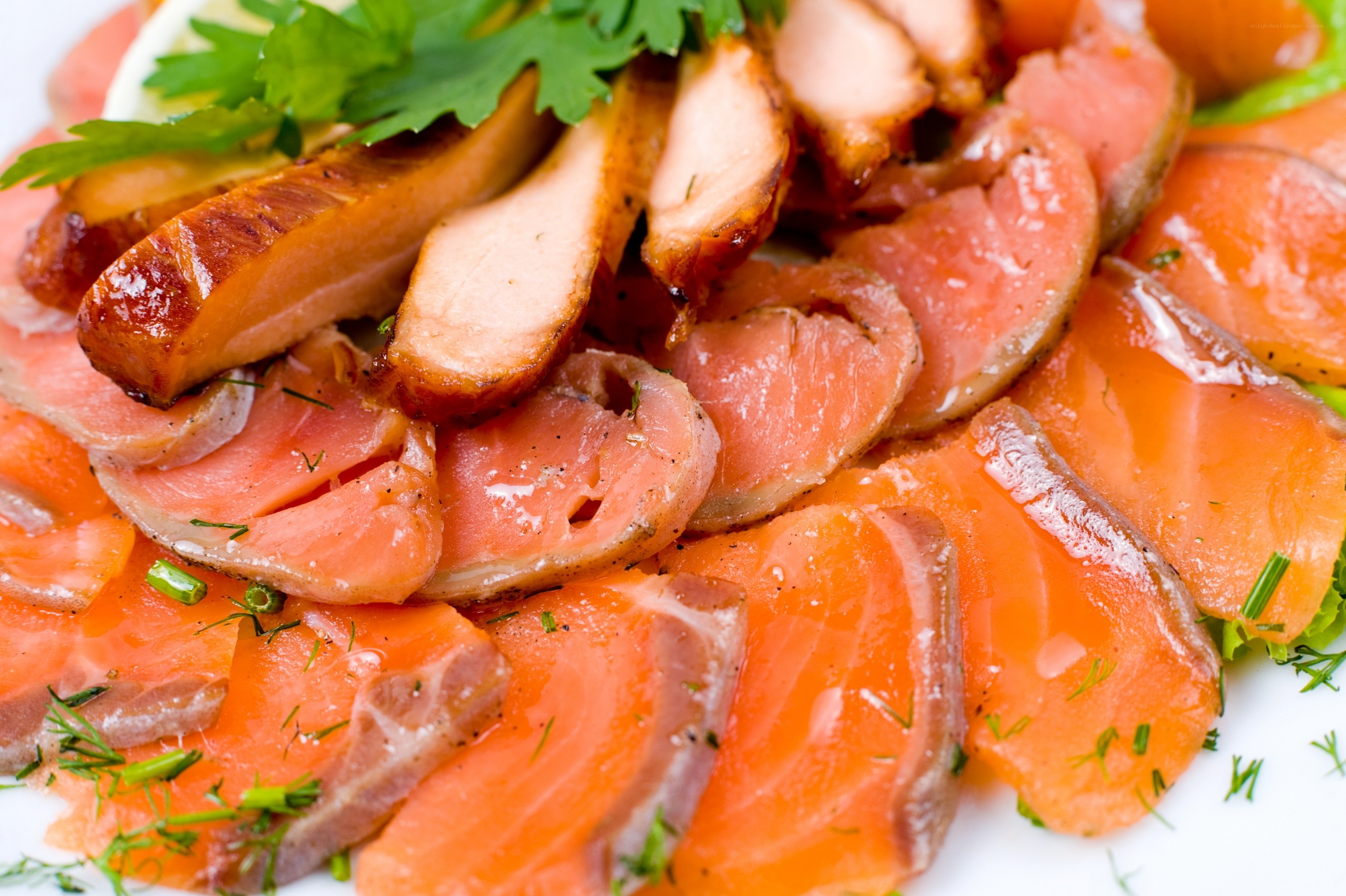 Sliced smoked salmon and chicken