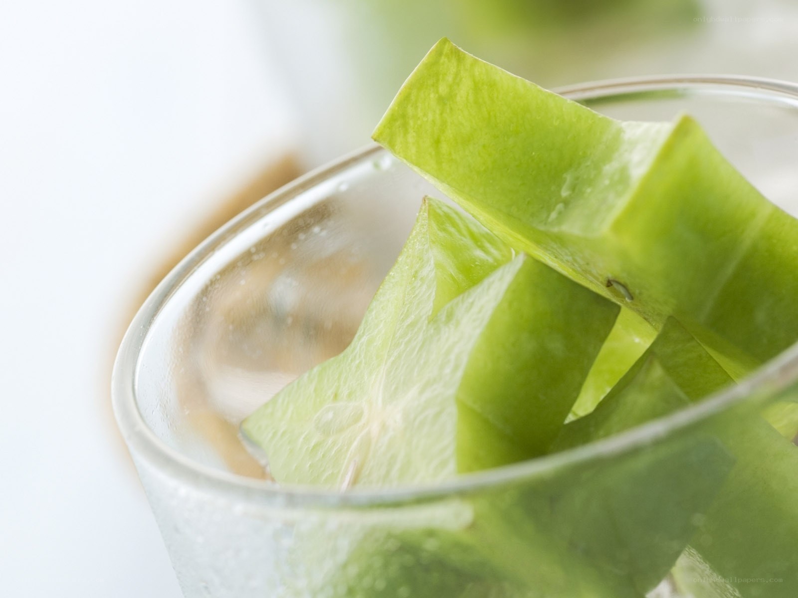 sliced star fruit in a glass