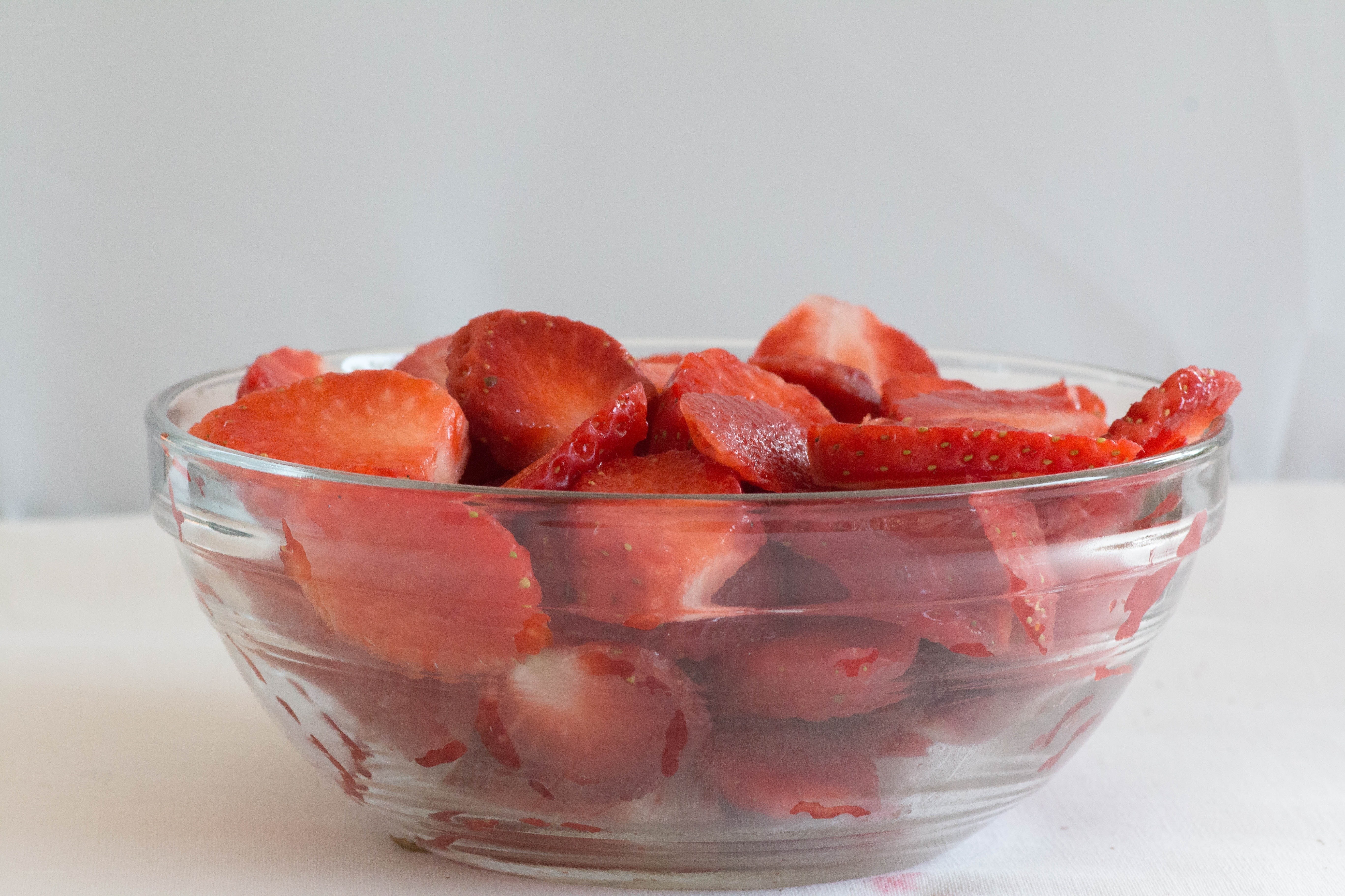 sliced strawberries in a bowl