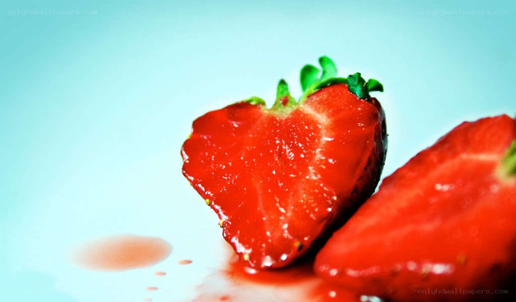 sliced strawberries on white